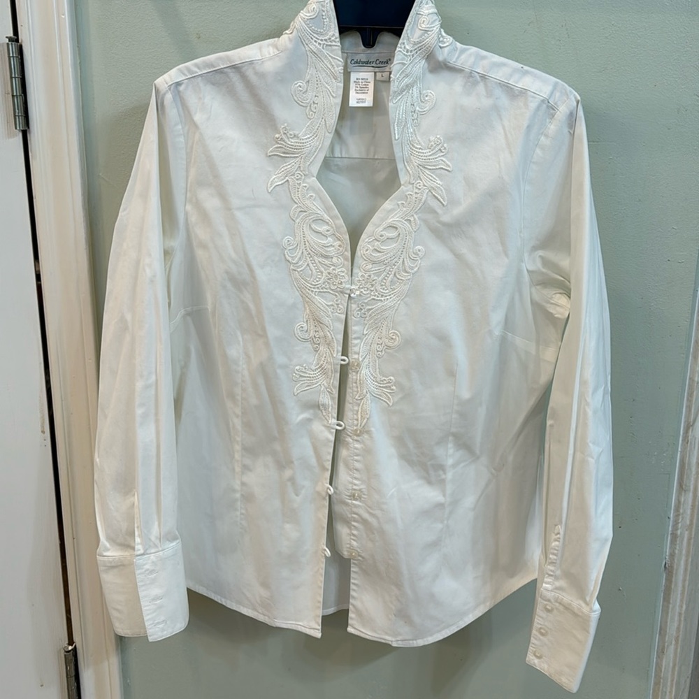 White embroidered button down top. Size L